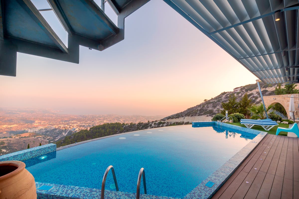 Infinity edge pool overlooking a hillside view